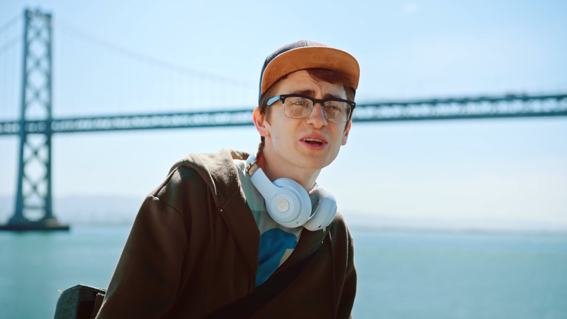 A young traveler in front of the Bay Bridge, from the inbound spot